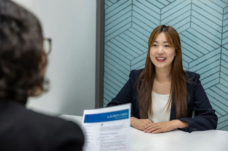 A Recruiter Interviewing a Woman